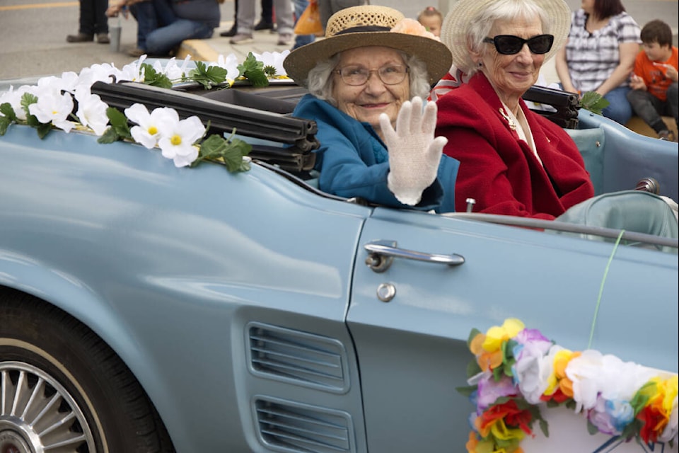 Helen Cade, left, and former May Queen Loretta Ferguson represent Clinton Creek Estates at the Clinton May Ball parade Saturday. (Kelly Sinoski photo - 100 Mile Free Press)