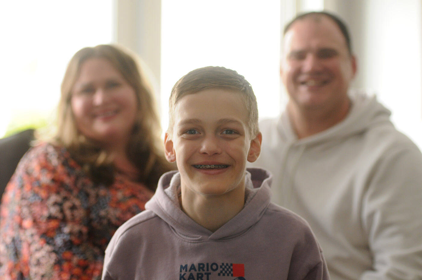 Thirteen-year-old Madden Wicker-Vriend, seen here with his parents Eryn and Jesse on May 27, 2022, is on dialysis at home in Chilliwack and is looking for a living kidney donor. (Jenna Hauck/ Chilliwack Progress)