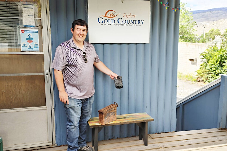 Jason Parchomchuk of 100 Mile House with the fire-damaged Salmon Valley geocache. (Photo credit: Gold Country Communities Society)