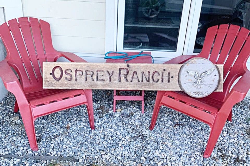 The Osprey Ranch sign, which was swept away by flooding near Spences Bridge in November 2021, takes a well-deserved rest after being found near Gibsons on the Sunhine Coast in January 2023, only a little the worse for wear after its long journey. (Photo credit: Submitted)