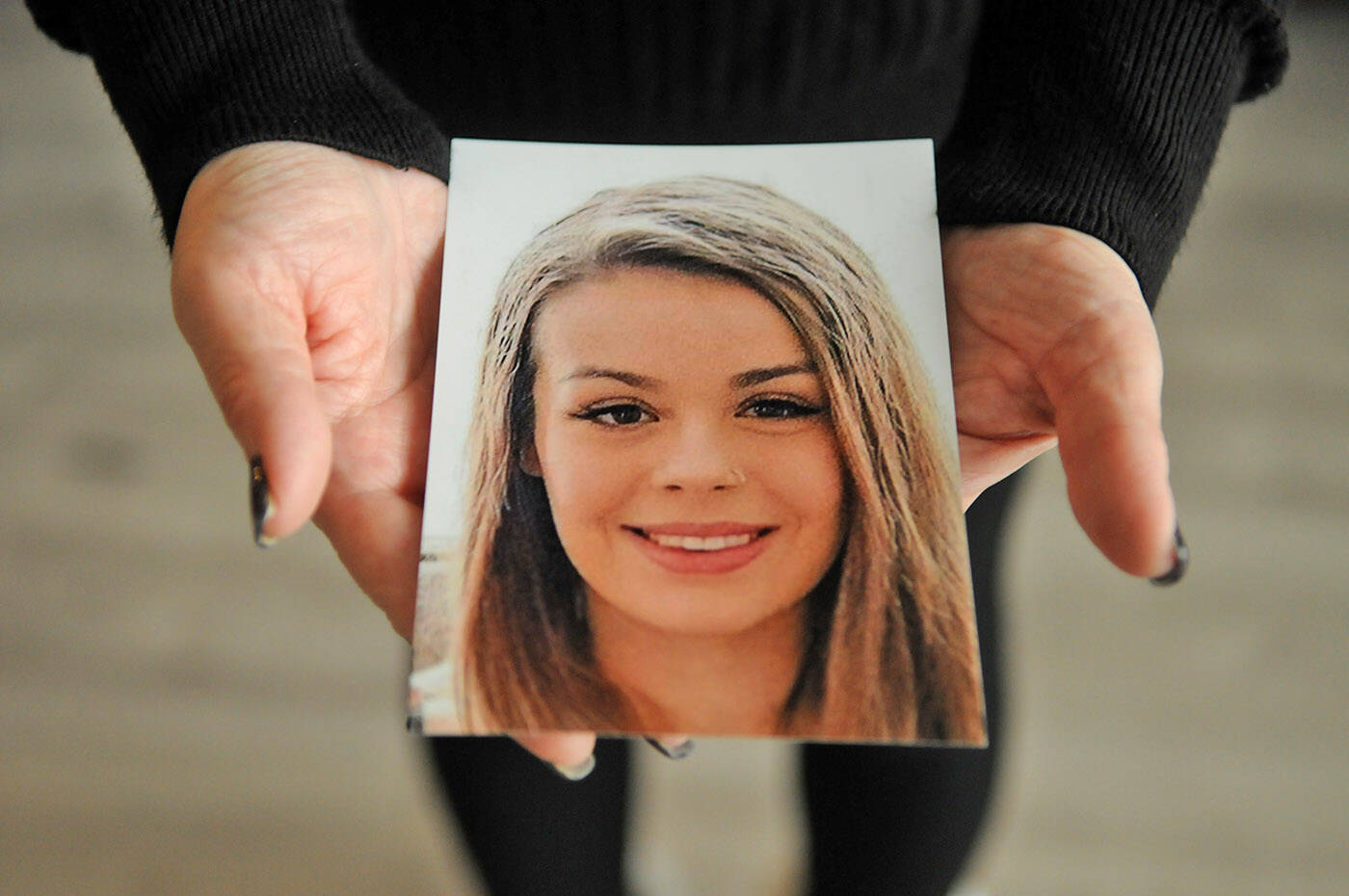 Alina Durham holds a photo of her daughter Shaelene Bell in her home on Jan. 12, 2023. Bell went missing on Jan. 30, 2021 and her body was found on June 2, 2021 in the Fraser River near Coquitlam. Durham has been trying for 18 months to get Shaelenes Missing Adult Alert in place, but nothing has happened. (Jenna Hauck/ Chilliwack Progress)