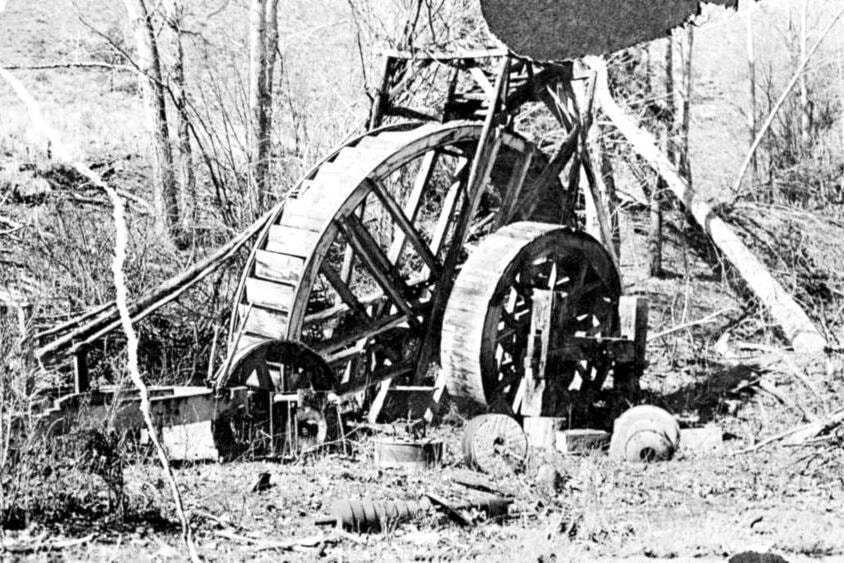 The remains of the grist mill at Ashcroft Manor, along with its mill stones, are shown in this undated photo, probably from the late 1920s. (Photo credit: Ashcroft Museum and Archives)