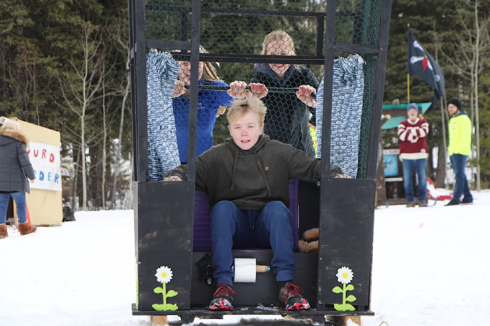 Williams Lake’s Dryden Campbell (center) competed in the Interlakes Outhouse Races with Robyn Campbell and Amelia Dell under the name TP Cruisers. (Patrick Davies photo - 100 Mile Free Press) Williams Lake’s Dryden Campbell (center) competed in the Interlakes Outhouse Races with Robyn Campbell and Amelia Dell under the name TP Cruisers. (Patrick Davies photo - 100 Mile Free Press)