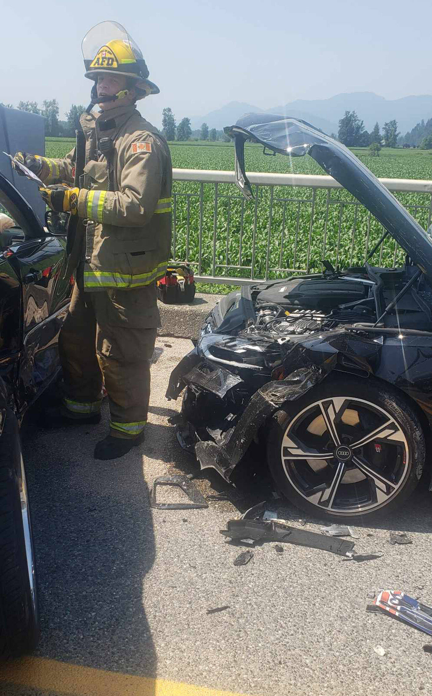 The scene of a four-vehicle crash on the Agassiz-Rosedale Bridge where a Chrysler 300 (left) collided with three vehicles including an Audi (right) on July 8, 2023. (Sukh Mattu)