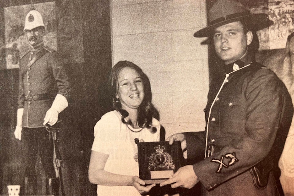 ‘R.C.M.P. Holds “Open House”’ (July 19, 1973): ‘Constable Ernie Lesiuk is shown here presenting Miss Jackie Andersen, 17, daughter of Mr. and Mrs. Ralph Andersen of Ashcroft, with a plaque with the inscription “RCMP Essay Contest — 1973 Winner”. The presentation was made during “Open House” at Ashcroft RCMP headquarters last Thursday, the occasion being RCMP Centennial Year. During the open house many interested visitors were shown the various ways the RCMP operated, including filing system, breathalyzer tester, fingerprinting, cell block, radar, etc. Refreshments were served during open house.’ Jackie Andersen is probably better known today by her married name, Tegart. (Photo credit: Journal archives)