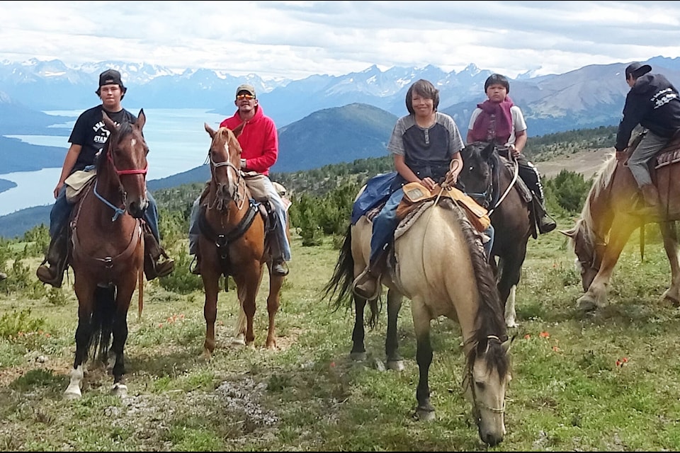 Riders with a view down Chilko Lake. Orrie Charleyboy, Aiden Squinas, Jonathan McEwan, Pacey Sulin, Kyle Squinas and Christian Sill Jack. (Photo submitted)