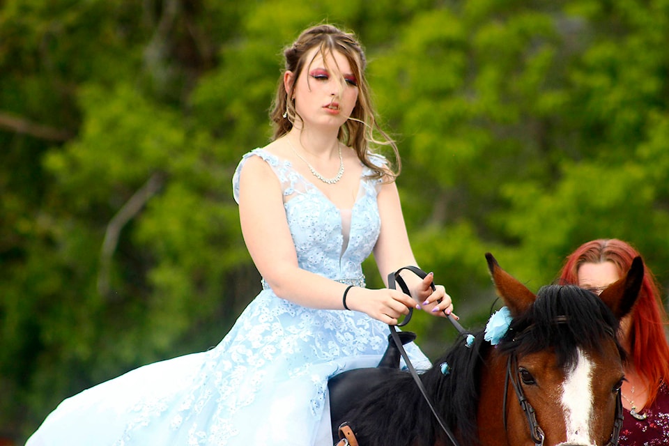 Chandra Fish rode her horse in the grad parade. (Emily Jaycox/Bashaw Star)