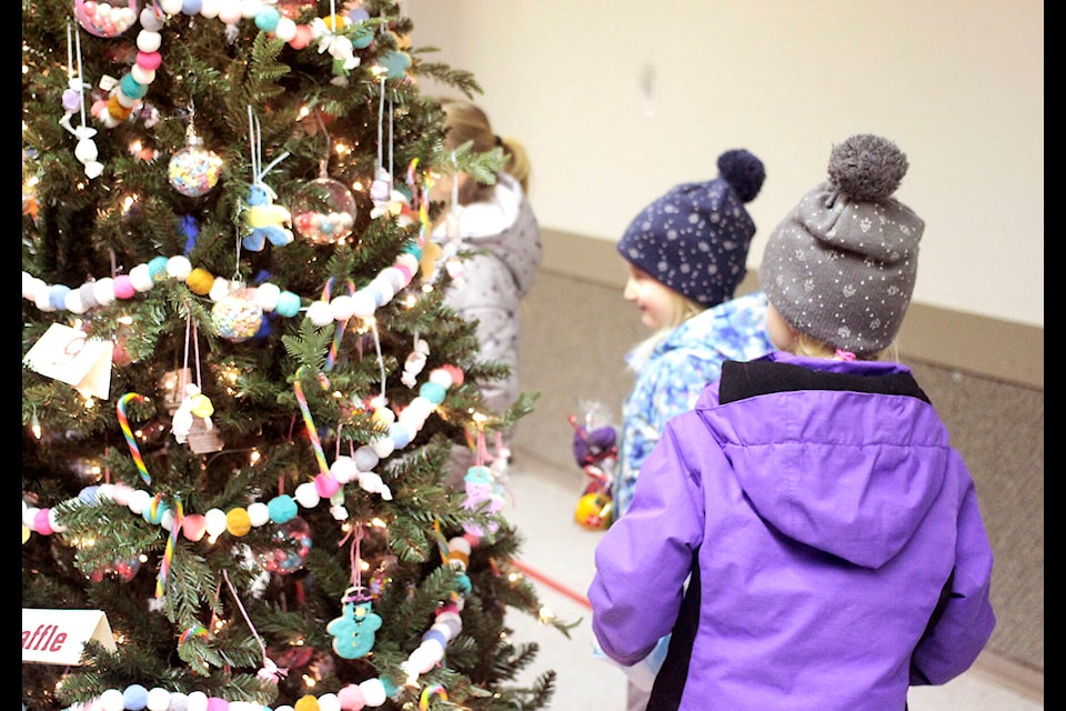 The Bashaw Festival of Trees was held at the Bashaw Ag Grounds from Dec. 3 to 5. The trees were auctioned off online and in person. On Dec. 4, children could get a photo with Santa. (Photos by Emily Jaycox/Bashaw Star)