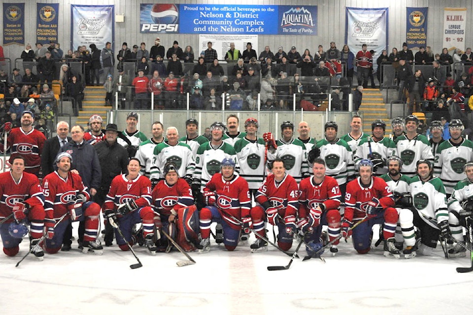 The Kootenay Patricks and Montreal Canadiens alumni share a photo at the end of Thursday’s charity game. Photo: Tyler Harper