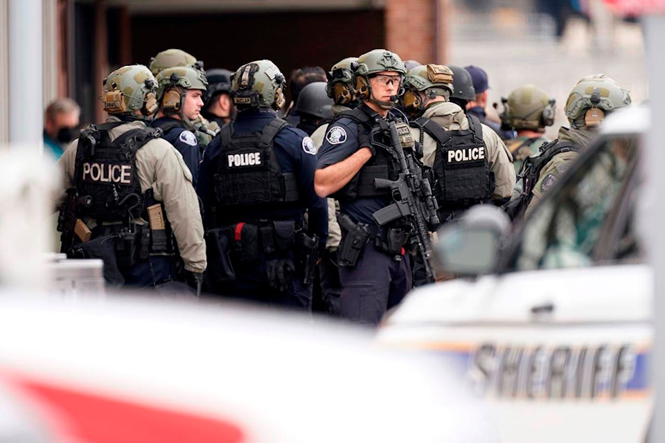 Police outside a King Soopers grocery store where a shooting took place Monday, March 22, 2021, in Boulder, Colo. (AP Photo/David Zalubowski)