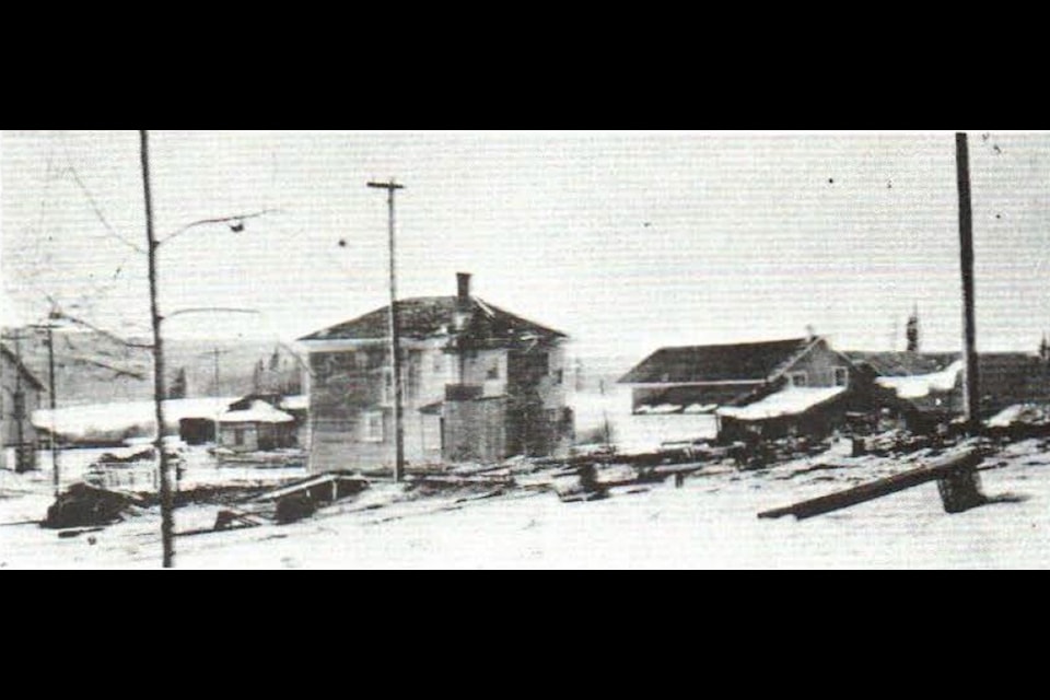 The smoking ruins of the C. E. Imeson store in downtown  Lake, July 28, 1924