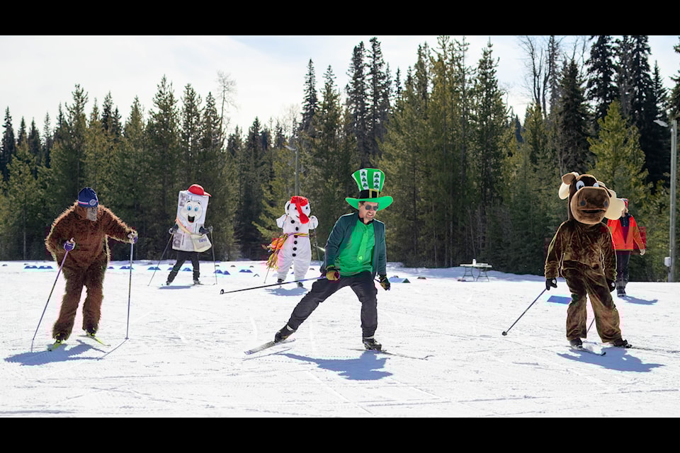 The Omineca Ski Club held their annual Loppet Race on March 16. One of the highlights every year is the mascot race. The racers consisted of Omineca Sasquatch, leprechaun, Lakes District  ie, Lakey the Moose and Bonhomme the snowman. Who won the race? Unfortunately, ie did not win the race. Omineca Sasquatch placed first, in part due to a pile up involving the leprechaun and Lakey the moose, followed by a spill by Bonhomme.  Resulting in Newies’ first trip to the podium in second place. Cost was $5 per person and under 12 was free which included a lunch.