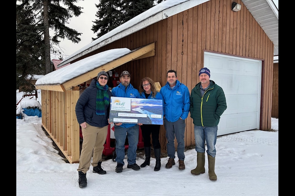 $6,346 from Nechako-Kitamaat Development Fund Society was given to the Omineca Ski Club to upgrade the fuel tank for the grooming machines for the ski trails.(Left to right) Cheyenne Murray (Omineca Ski Club) Ken Guenter (NKDF Director) Cindy Shelford (NKDF Chair) Quinten Beach (NKDF Director)  and Randy Hamp (Omineca Ski Club).