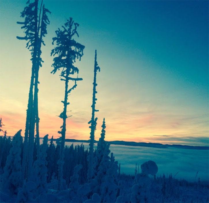 Skiing above a cloud blanketed valley