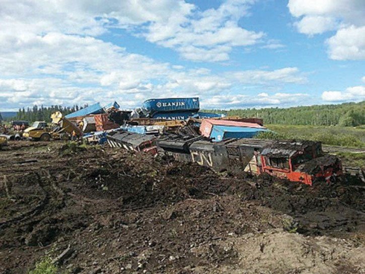 Train collides with loaded logging truck