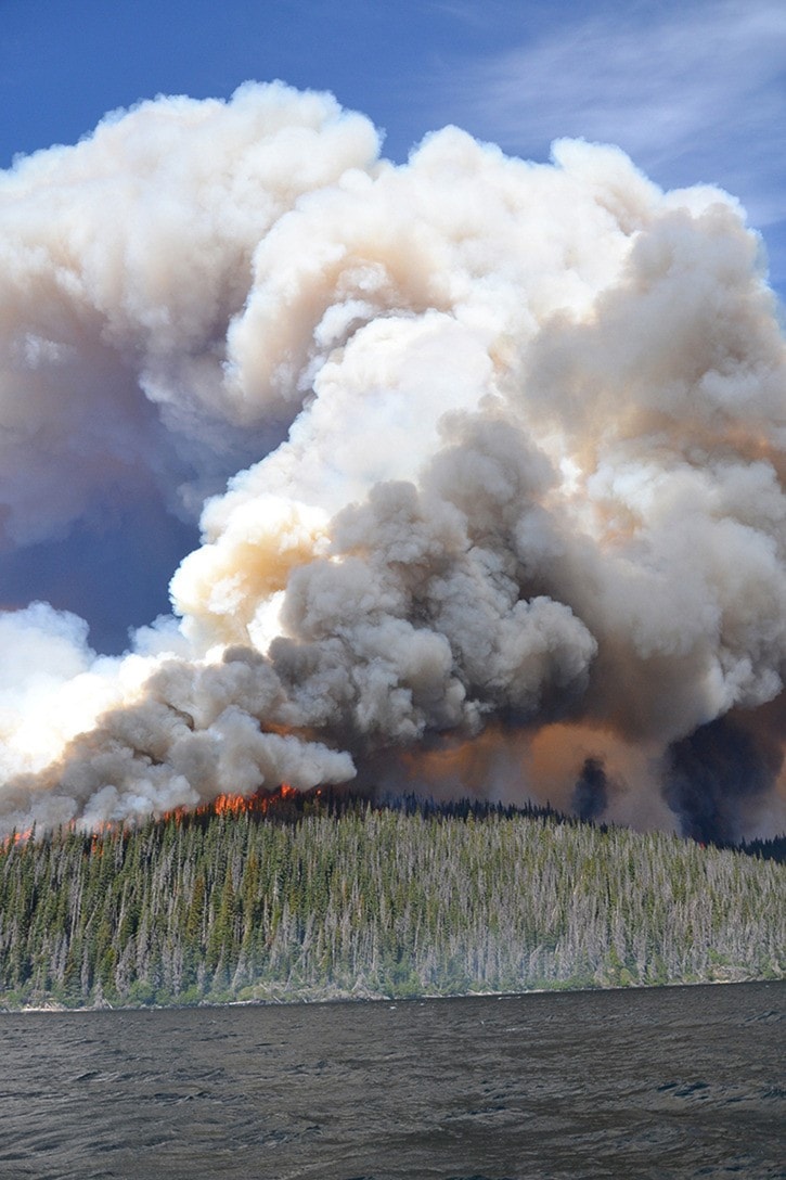 Forest fires continue to burn in the Northwest as help is flown