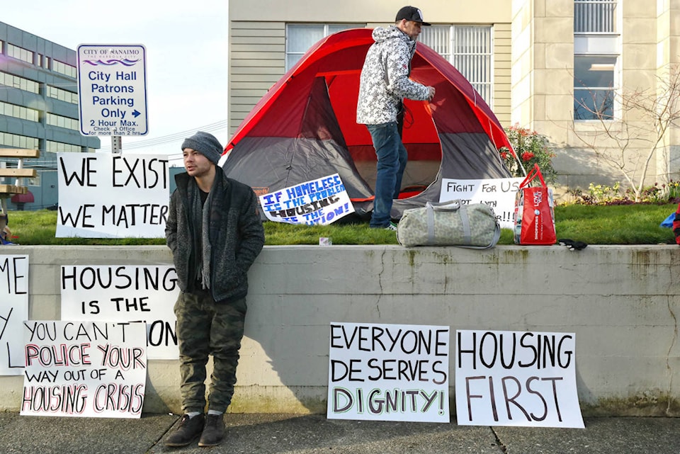 10990668_web1_10969546_web1_180313-NBU-Homeless-camp-in-cropped---03120028-640x4272x