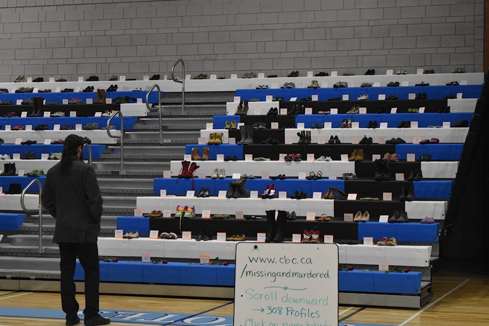 A teacher looks at the memorial. Heather Norman photos