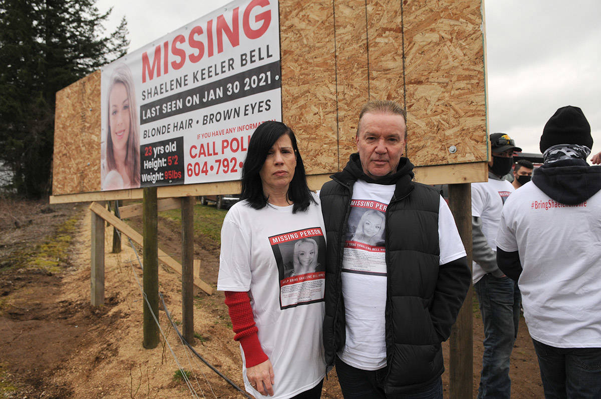 Alina and Kevin Durham, Shaelene Bell聮s mother and step-father, stand in front of the banner in Abbotsford near Bradner Road on Saturday, March 27, 2021. (Jenna Hauck/ Chilliwack Progress)