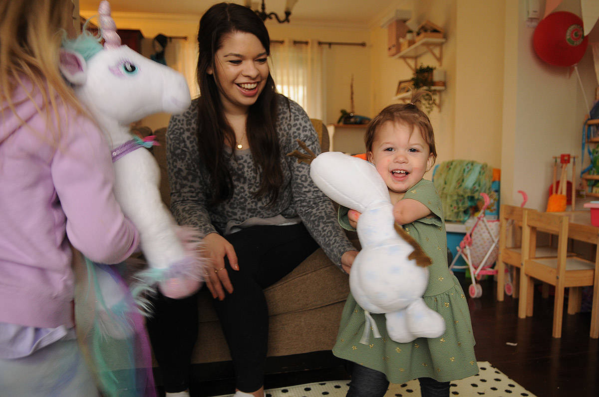 Two-year-old Ivy McLeod, seen here on April 9, 2021 with four-year-old sister Elena (left) and mom Vanessa, was born with limb differences. The family, including husband/dad Sean McLeod, is looking for a family puppy that also has a limb difference. (Jenna Hauck/ Chilliwack Progress)