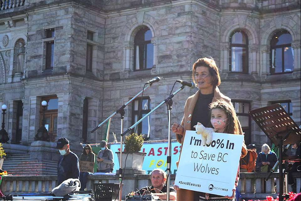 Rebeka Breder, animal law lawyer and legal counsel for Pacific Wild, speaks with her daughter outside the B.C. legislature building about the ongoing suit against B.C.’s wolf hunting practices. (Kiernan Green/News Staff)