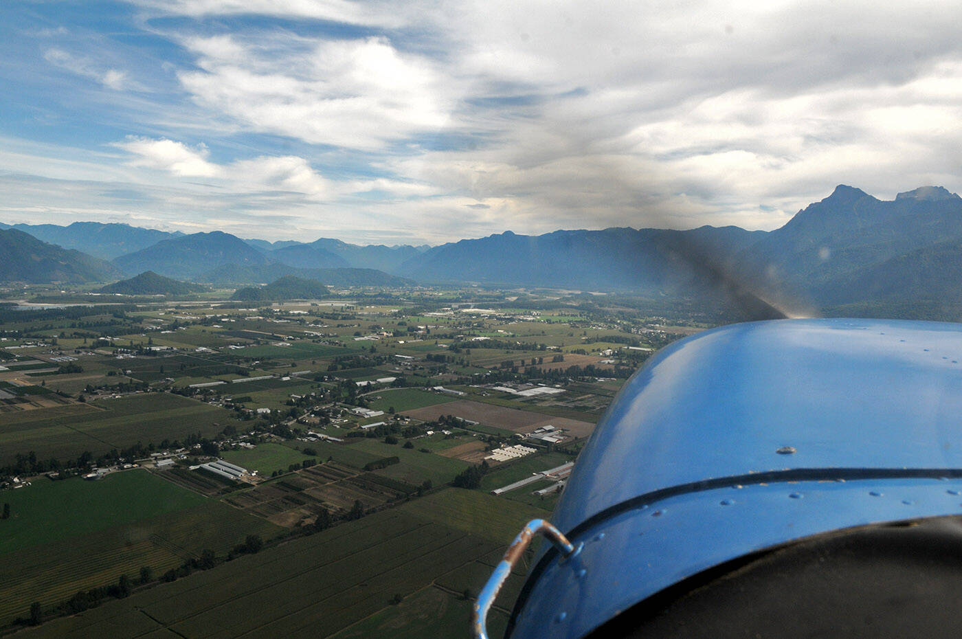 A plane flown by Kim Lysak, assistant chief flight instructor with Aurora Aviation Academy, soars over Chilliwack on Sept. 9, 2021. (Jenna Hauck/ Chilliwack Progress)