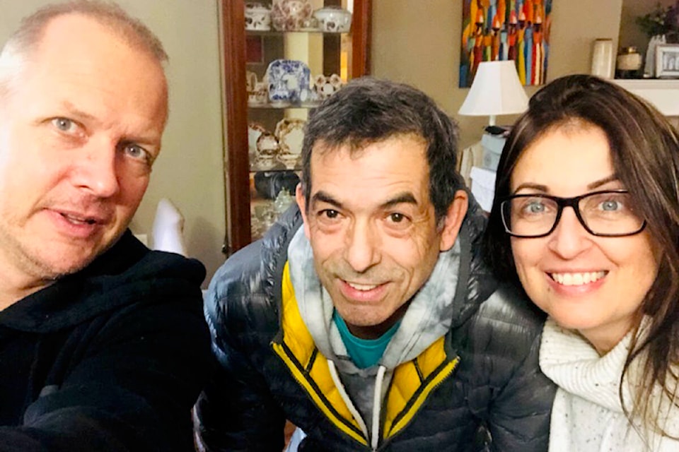 Dave Craik and Lisa Craik with the kind man who opened his home to them for shelter in Hope. (Special to The )