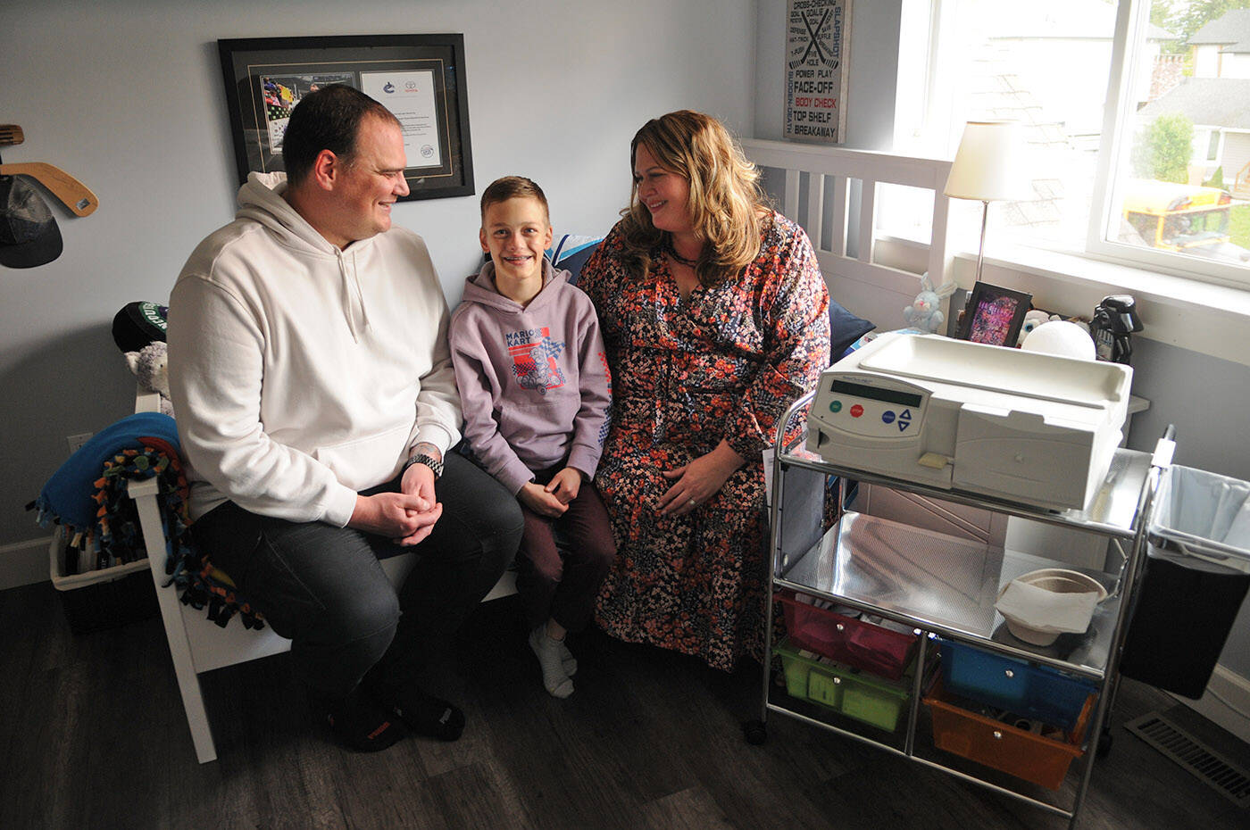 Thirteen-year-old Madden Wicker-Vriend, seen here with his parents Eryn and Jesse on May 27, 2022, is on dialysis at home in Chilliwack and is looking for a living kidney donor. (Jenna Hauck/ Chilliwack Progress)