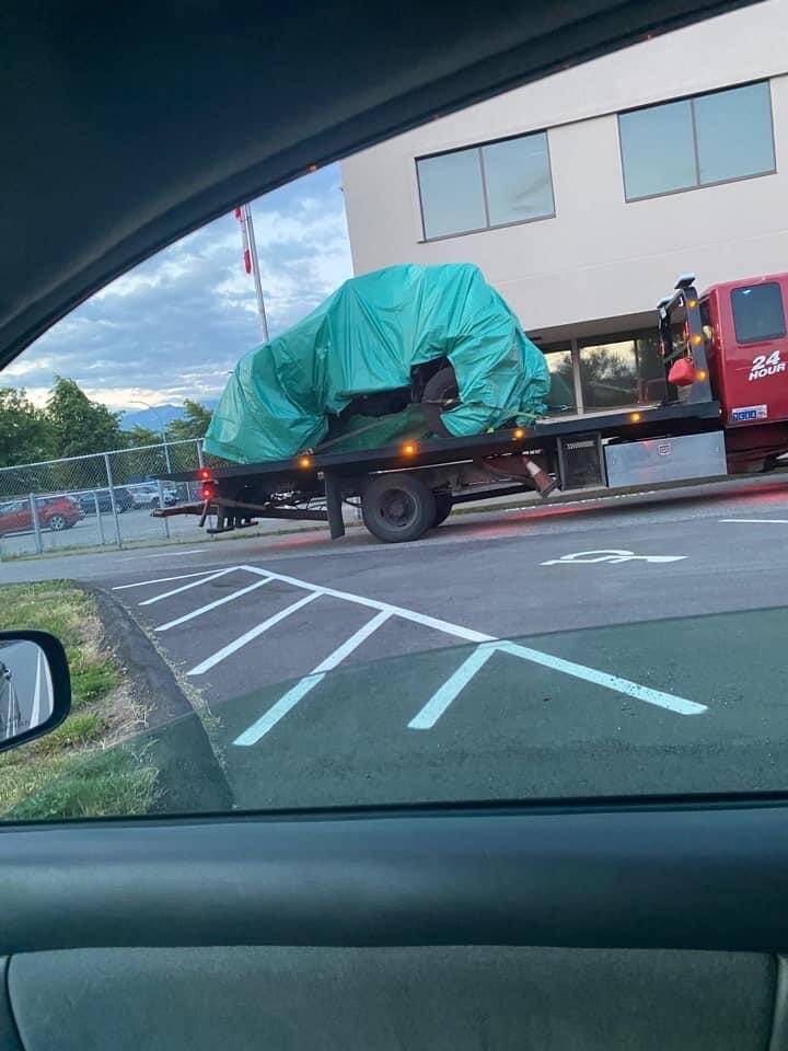 A photo of the tarp-covered vehicle. (Facebook)