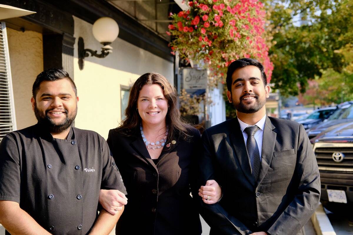 Chef Rahul Joshi (left) and Harman Deep Singh (right) with their employer Tanya Finley of Finley聮s Bar and Grill. Singh is a student in the culinary management program at Selkirk College, and Rahul is a 2019 graduate. Photo: Bill Metcalfe