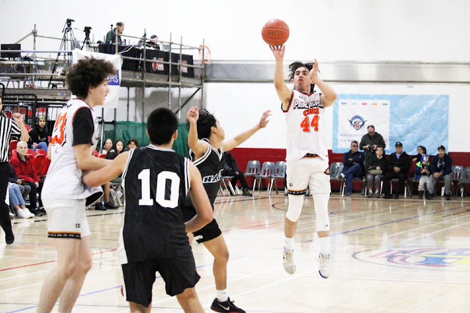 Second-ranked Prince Rupert’s Colby Stephens fires from beyond the arc in Intermediate action against Massett at the All Native Basketball Tournament Feb. 13. (Thom Barker photo)