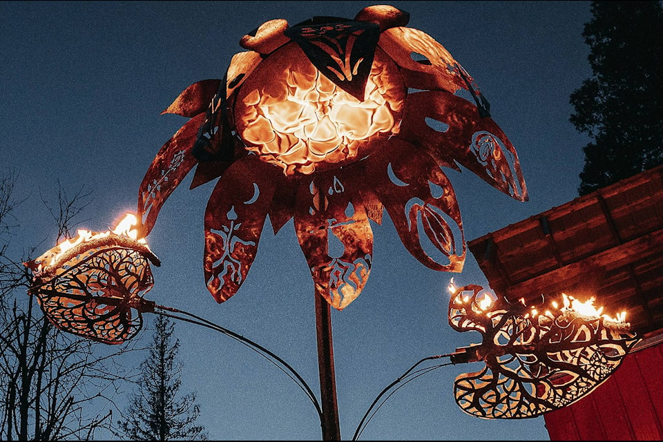 Ignus, the 10.5-foot steel and aluminum sunflower art installation created by Terrace artist Jordie Laidlaw and his team. Inspired by his experiences as an ICU nurse during the COVID-19 pandemic, the piece is set to embark on a 2,500-kilometre journey to Burning Man, symbolizing resilience, connection, and creativity. (Vilk Studios photo)