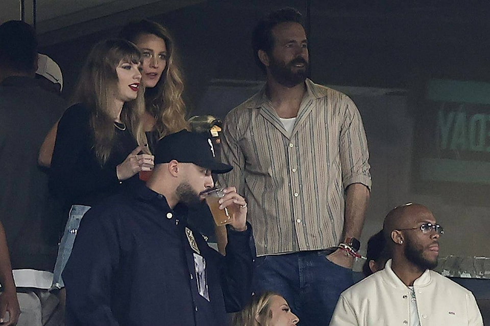 Taylor Swift, left, watches play between the New York Jets and the Kansas City Chiefs of an NFL football game, Sunday, Oct. 1, 2023, in East Rutherford, N.J. (AP Photo/Adam Hunger)