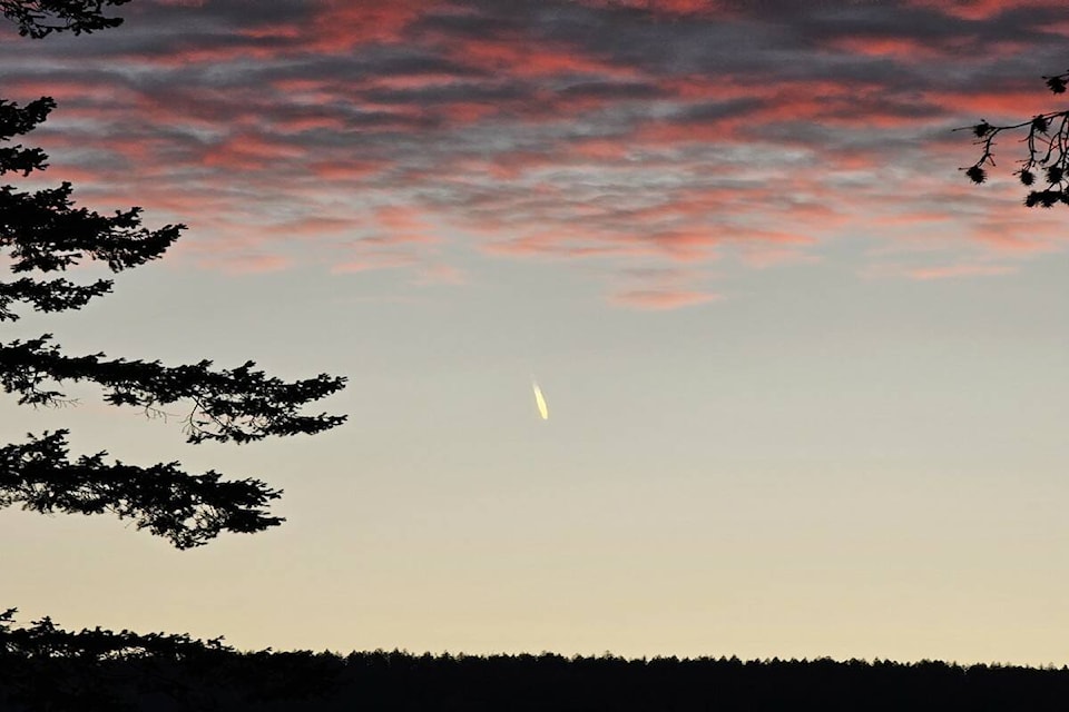 Saturday’s (Oct. 28) sunset over Canoe is highlighted by what mountain biker/photographer Kevin Silverson believes to be meteor. (Kevin Silverson photo)