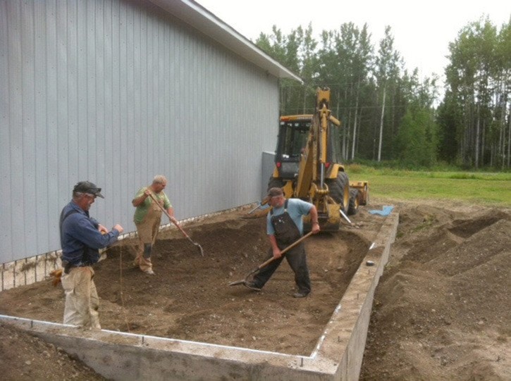 Volunteers work on the addition to the Sowchea Fire Hall.
John Bennison Photo