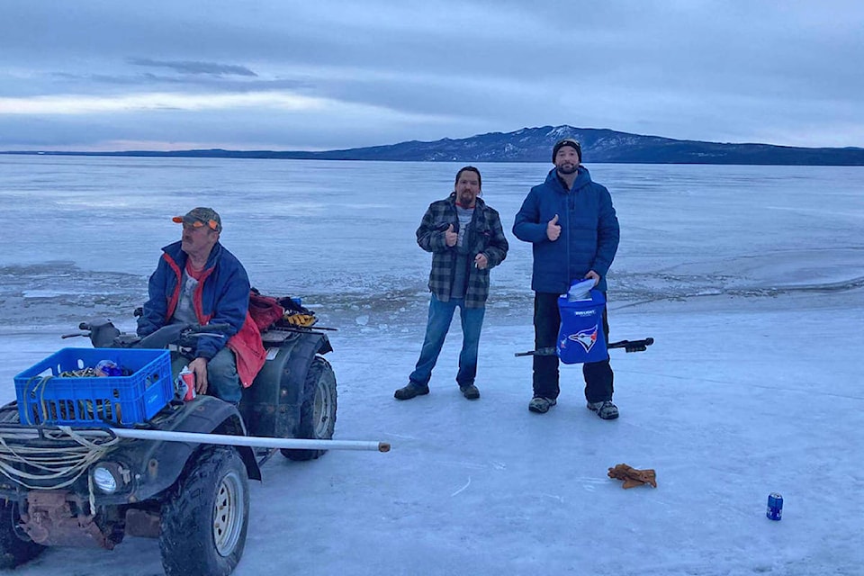 Binche residents Doug Connors (left) with Ross Duncan and Paul Lewis were thrilled after a mission to rescue a moose stranded on Stuart Lake was successful Friday, April 2. (Photo submitted)