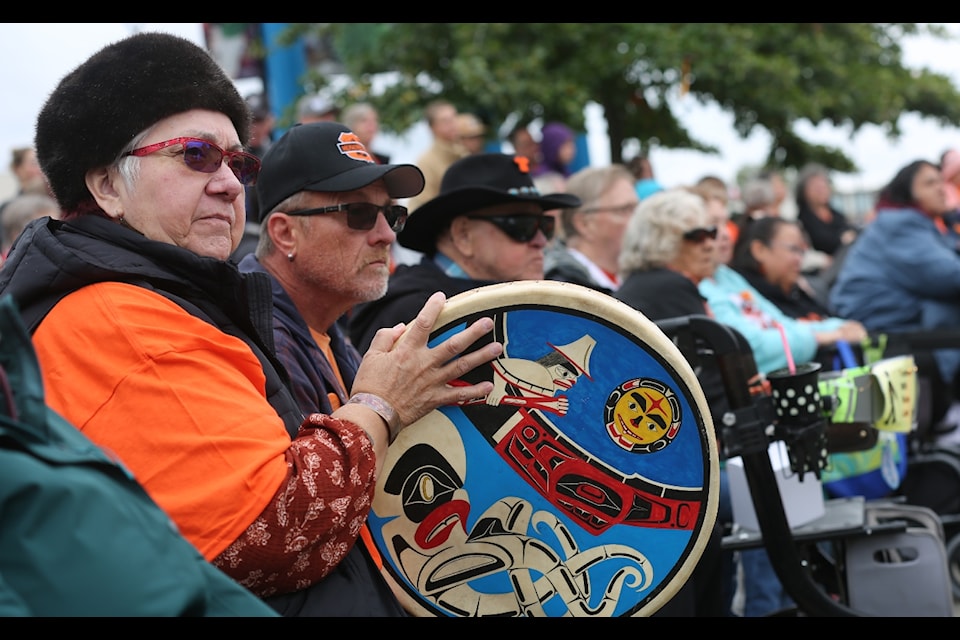 Beryl Parke, a member of the Haida Nation, holds the Haida drum crafted by her brother in the 1990s during the National Day for Truth and Reconciliation and Orange Shirt Day ceremony in Spirit Square in downtown Campbell River on Sept. 30. 