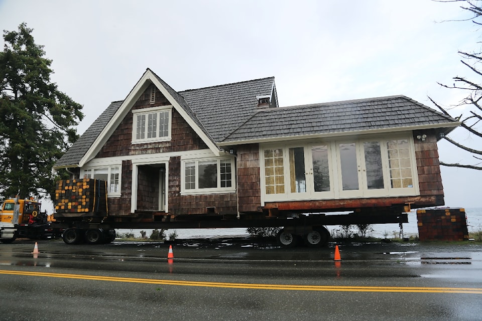 A historical house from Qualicum Beach, once belonging to the MacMillan family, owners of the prominent forestry company, has been saved from demolition and was successfully moved to Oyster Bay on Sept. 26.