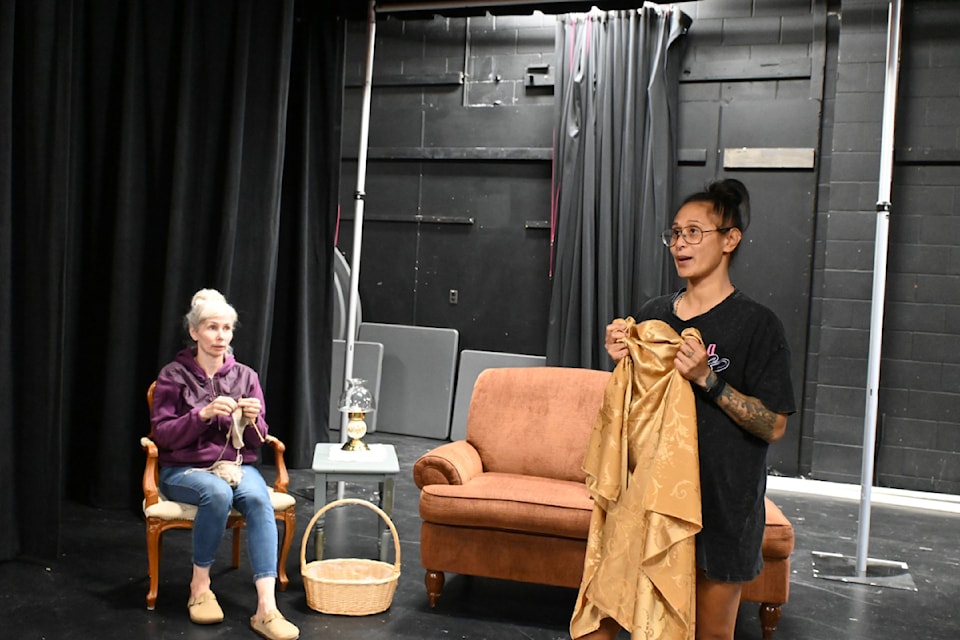 Susan Wydenes and Cielo Richardson rehearsing a scene from Still Stands the House.