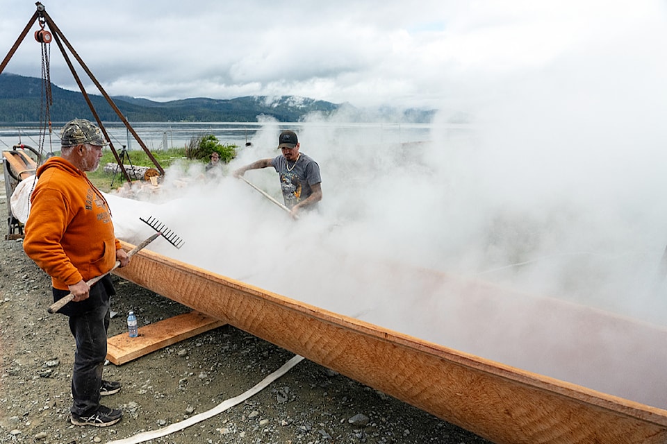 The interior of the canoe is steamed with hot rocks and water to soften the wood and allow it to be spread to increase the capacity. 