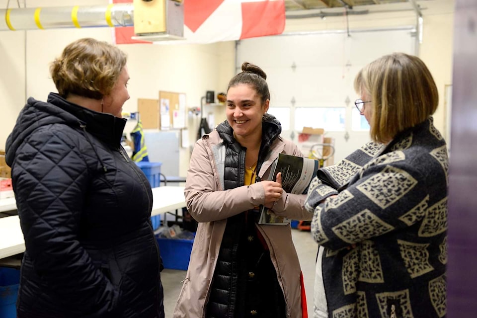 Tanille Johnson (centre) speaks to North Island-Powell River MP Rachel Blaney (left) and Jo Watson from the Campbell River Food Bank (right).