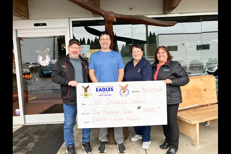 L-R Mike Wilson, BC Children’s Hospital representative Devin Miller, Marilyn Lewis, Franca Warkentin.