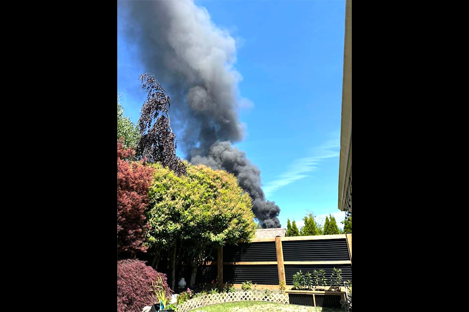 Smoke can be seen from a fire near Twilingate Rd. 