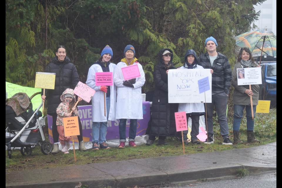 Members and supporters of Doctors for Safer Drug Policy at their site in Campbell River on March 25.