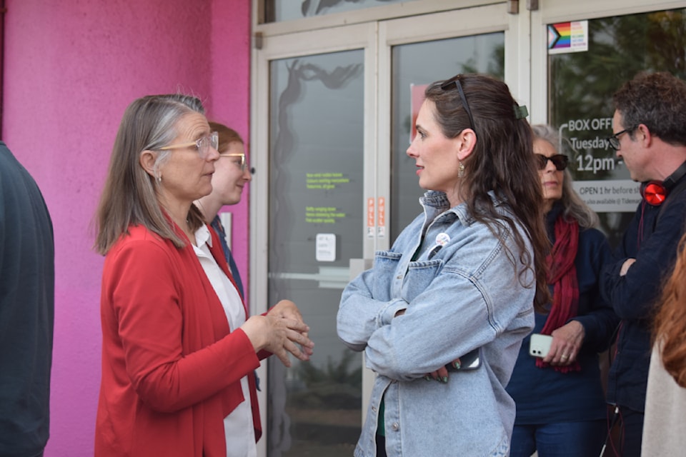 Liberal's Jennifer Lash and Green Party's Jessica Wegg converse during the aftermath of Campbell River's cancelled All-Candidates Forum.