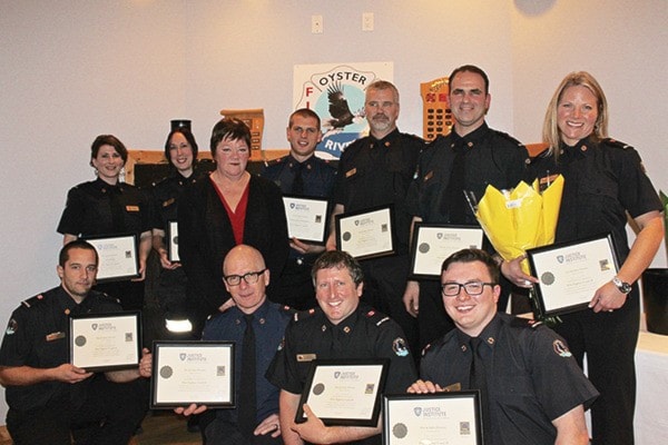 Brenda Leigh, Area D Director, with the Firefighter 2 certificate recipients.