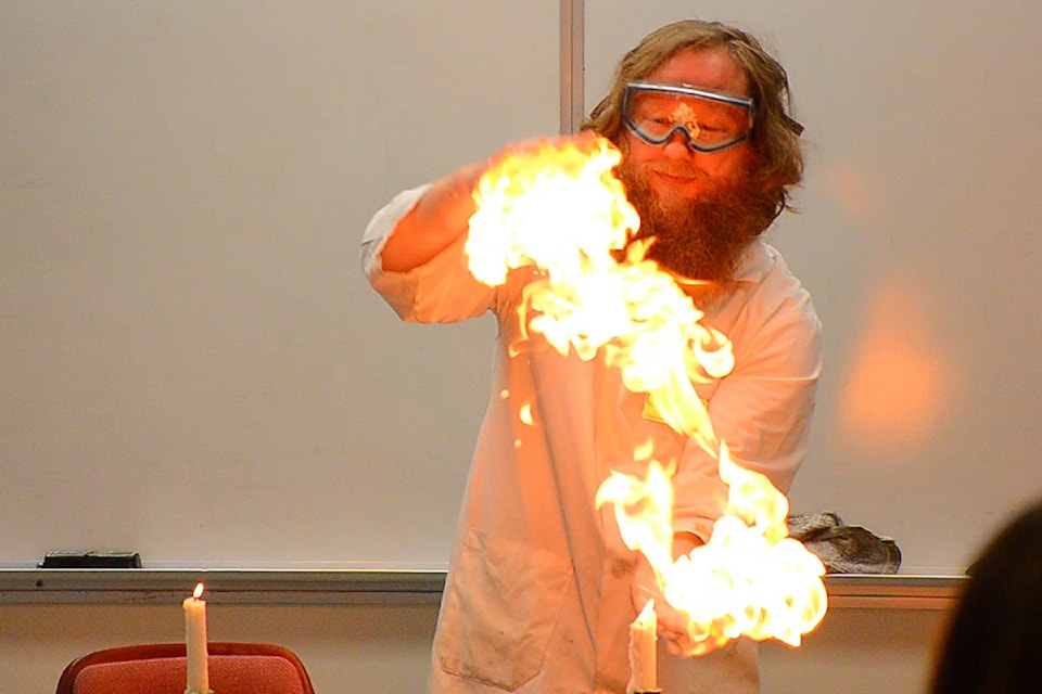 The ‘Famous Flaming Hands of Death’ North Island College chemistry instructor Darren George demonstrates the Famous Flaming Hands of Death (FFHD) at the Community Science Celebration at the Campbell River campus of NIC. The FFHD is all part of an entertaining presentation about chemistry that was part of the science celebration put on by Science World. See mor ephotos on page 3. Photo Alistair Taylor/Campbell River Mirror