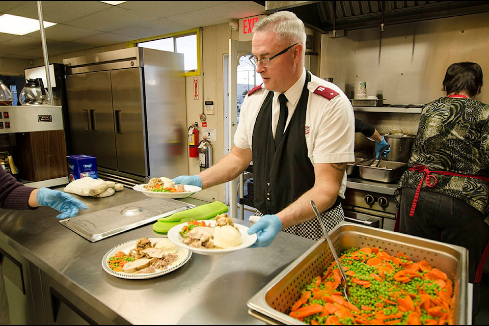 Capt. Keith Hopkins is one link in the relay chain distributing turkey dinners at Dodd’s 2nd Annual Thanksgiving Dinner at the Salvation Army Lighthouse Community Kitchen on Friday. Photo by Alistair Taylor/Campbell River Mirror
