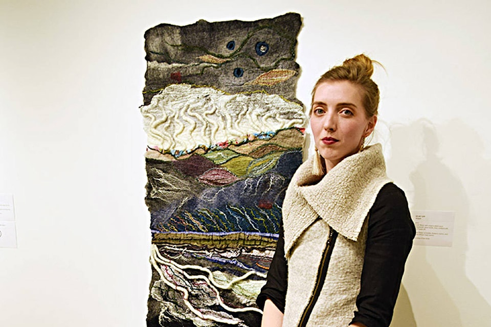 Feltmaker and fibre artist Kelsey Epp of Black Creek, in front of a work titled Hiraeth (2019), a hard-to-translate Welsh term referring to profound heartbreak. Photo by David Gordon Koch/Campbell River Mirror