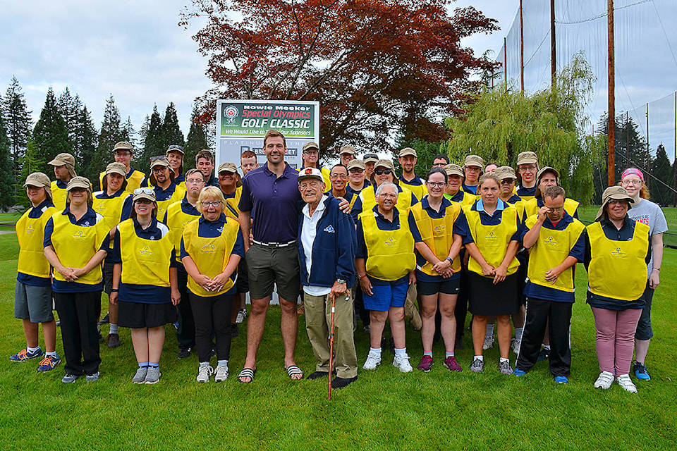 Campbell River Special Olympians served as caddies and volunteers at the 31st annual Howie Meeker Golf Classic held at Campbell River Golf and Country Club and co-hosted this year by Clayton Stoner (centre in purple) and Howie Meeker. Photo by Alistair Taylor/Campbell River Mirror